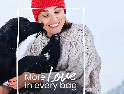 woman with two dogs and Muenster dog food tagline more love in every bag