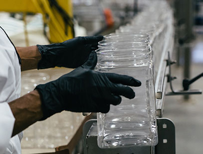 Plastic jars on an assembly line